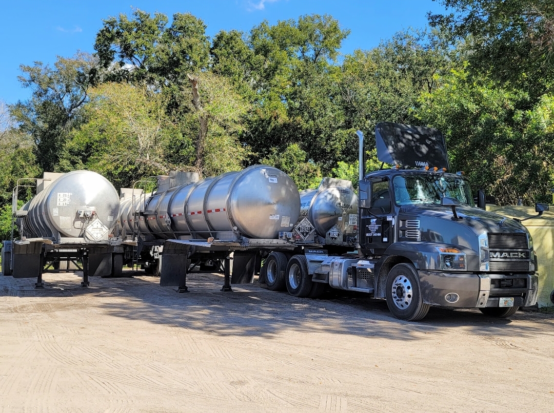 Mack tractor with chemical tanker trailers